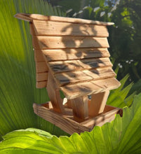 Wooden Bird Feeder: Serene garden birdwatching with hanging table.