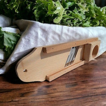Small wooden mandolin slicer that will last for years of use. Don't use cheap plastic slicer that brake in few months or add unhealthy plastic to your food.