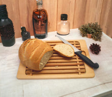 Anyone who loves a clean table or countertop will fall in love with this wooden bread cutting board or even better crumb catcher plate.